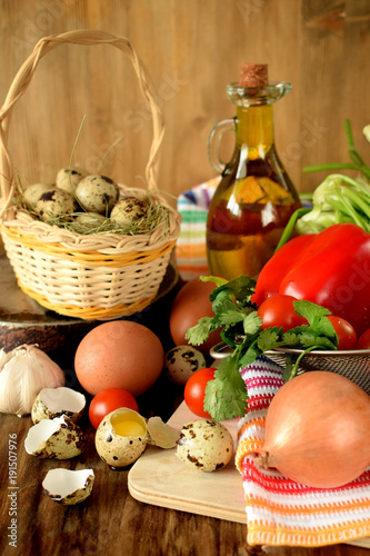 Fototapeta Naklejka Na Ścianę i Meble -  Ingredients for cooking fried eggs with vegetables on wooden background