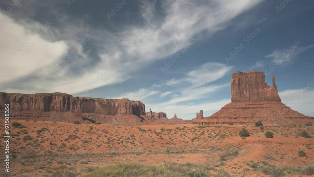 panning shot of west mitten and sentinel mesa at monument valley in utah, usa panning shot of west mitten and sentinel mesa at monument valley in utah, usa
