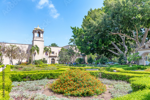 SAN DIEGO, CA - JULY 30, 2017: Tourists in Alcazar Garden, Balboa Park. San Diego attracts 20 million people annually