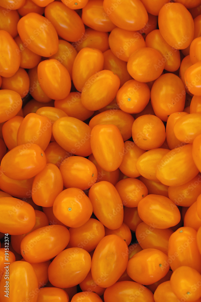 Close up fresh yellow cherry tomatoes in retail