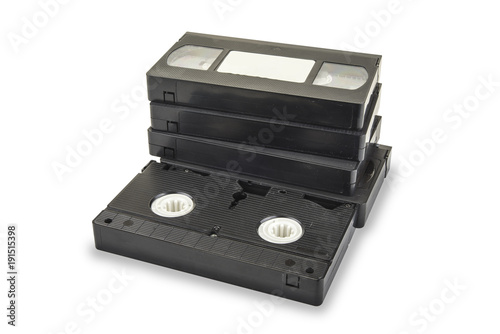 Pile of black vhs videotapes on the white background