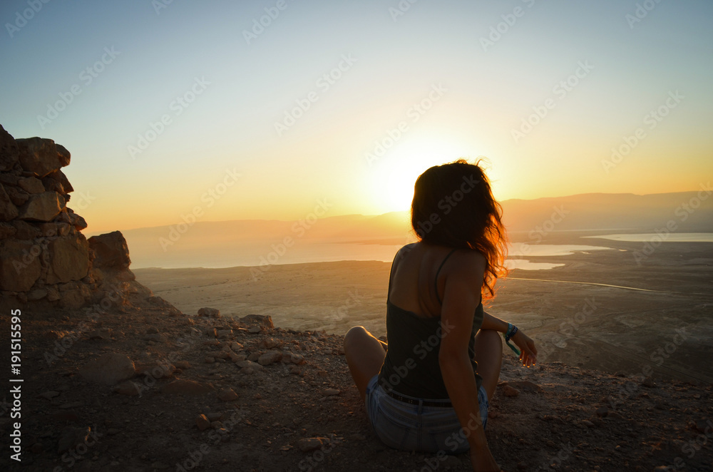 Silhouette young woman practicing yoga at sunset. Silhouette young woman practicing yoga at sunset.
