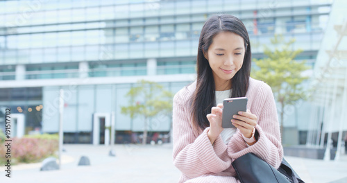 Woman working on mobile phone