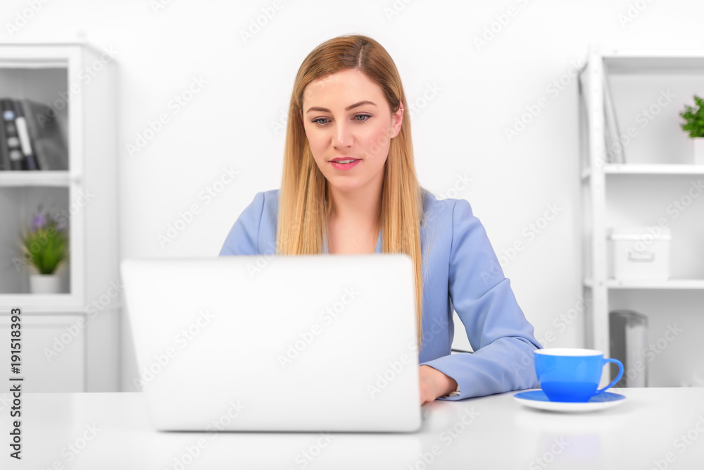 Business attractive woman working on laptop at workplace or at home. Business attractive woman working on laptop at workplace or at home.