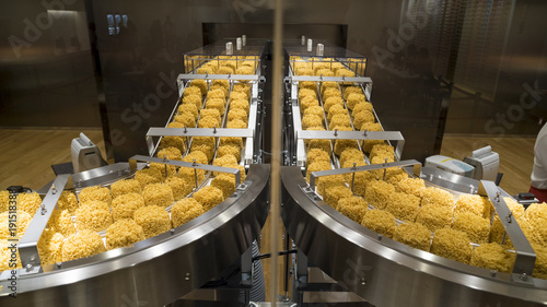 Instant noodles on conveyor belt in production process