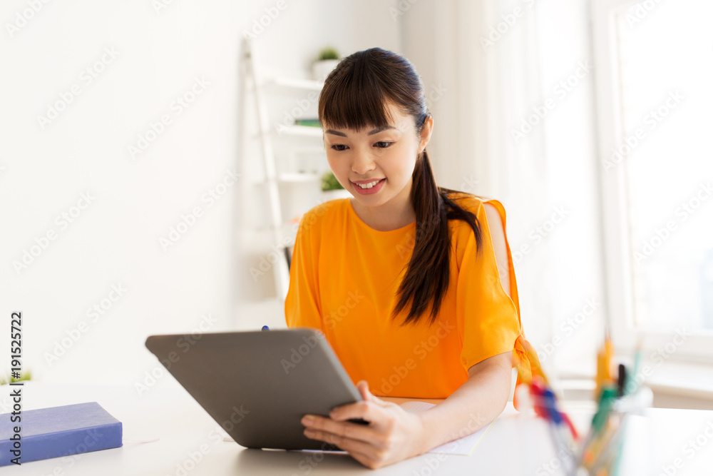 asian student girl with tablet pc learning at home asian student girl with tablet pc learning at home