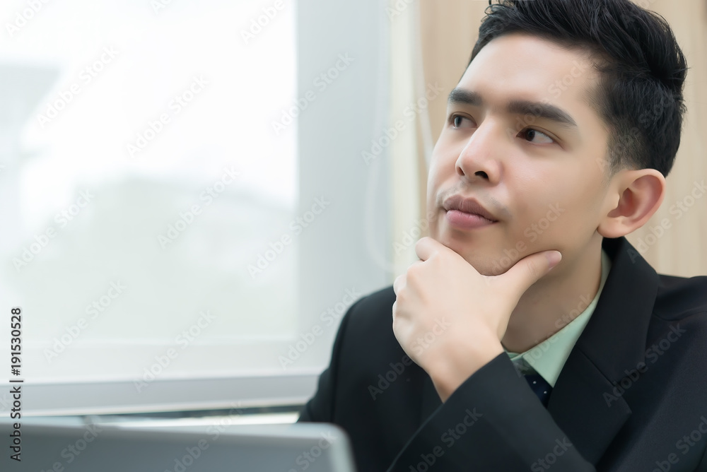 Asian businessman think about work at office,Thailand worker have an ideas for project for tomorrow Asian businessman think about work at office,Thailand worker have an ideas for project for tomorrow