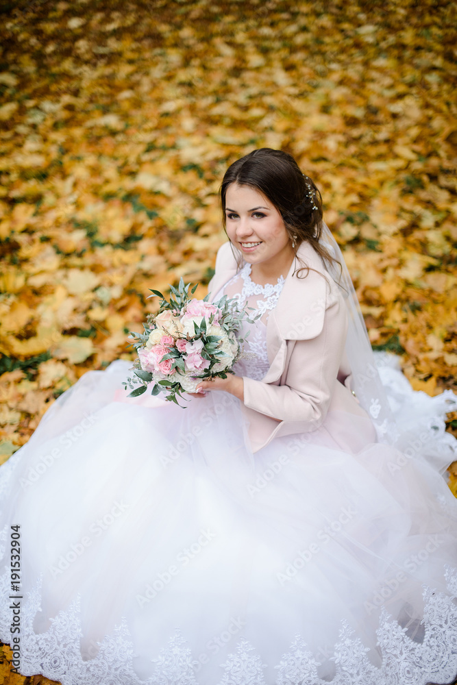 happy bride on autumn forest. young beauty bride with big eye happy bride on autumn forest. young beauty bride with big eye