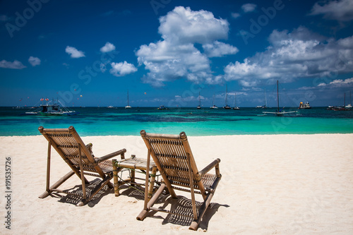 Tropical vacation on white sand beach with sun and blue sky at Boracay  Philippines.
