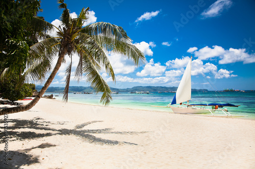 Philippine traditional sail boat on White Beach. Boracay, Philippines. photo