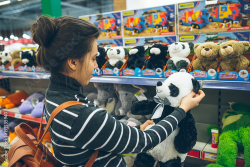 woman look for soft panda toy