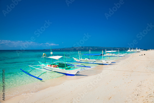 Traditional boat that do a island hopping in the beautiful Puka Beach Boracay. Philippines