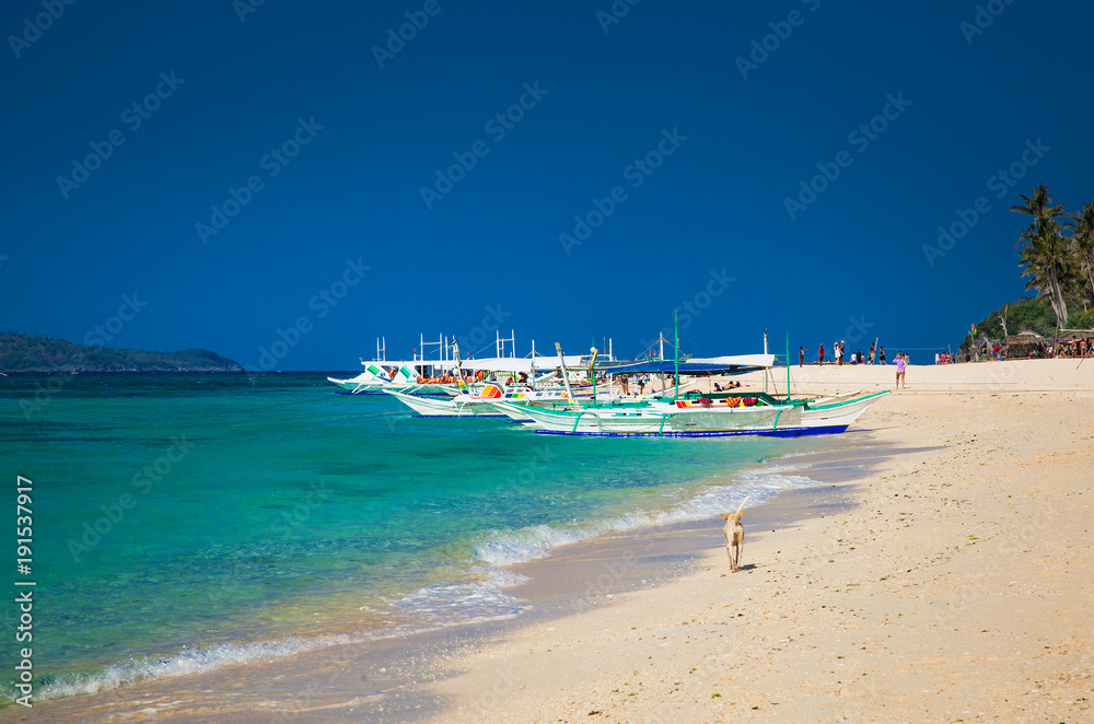 Traditional boat that do a island hopping in the beautiful Puka Beach Boracay. Philippines Traditional boat that do a island hopping in the beautiful Puka Beach Boracay. Philippines