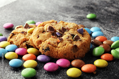 Chocolate cookies with colorful candies. Chocolate chip smarties cookies. photo