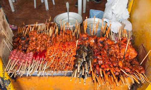 Delicious stick of roasted grill on street market. Cebu. Philippines.