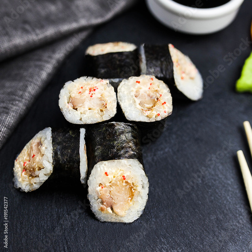 Japanese sushi rolls maki on the graphite board