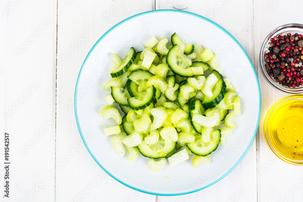 Dietary vegetarian salad of celery, cucumber and olive oil Dietary vegetarian salad of celery, cucumber and olive oil