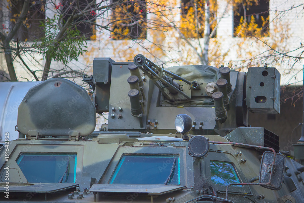 military equipment and tank on the streets of the city