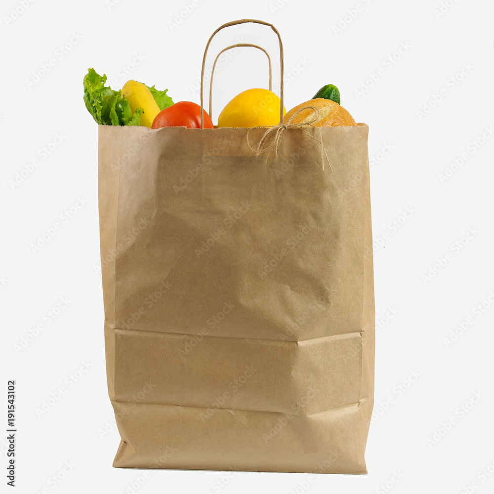 Brown Paper Shopping Bag Full Of Groceries On White Backdrop Stock