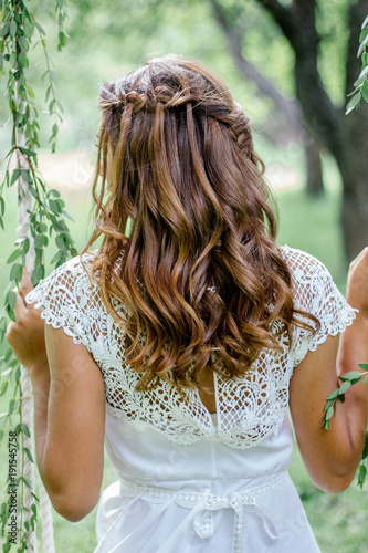 Beautiful wedding hairstyle with the bride turning back.