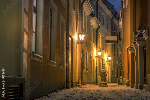Fototapeta Naklejka Na Ścianę i Meble -  Riga Old town in winter covered with snow. Historical buildings, popular landmarks, authentic architecture. Small streets with cobblestone.