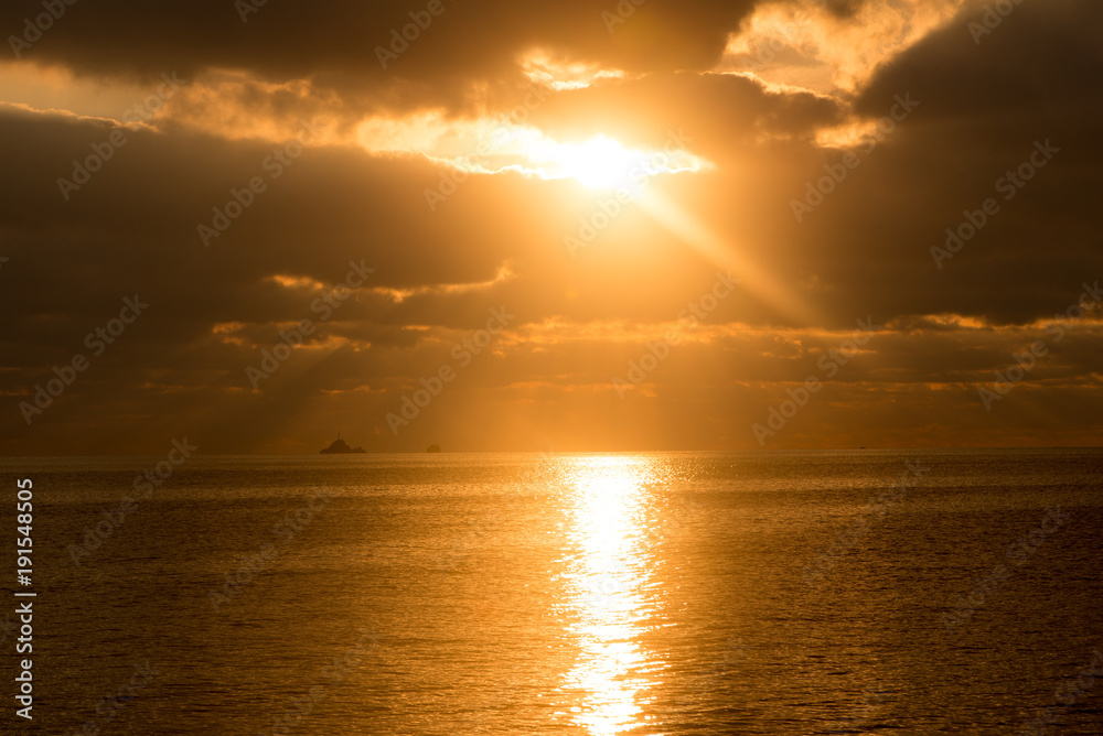 A golden sunrise in the sea of Ibiza