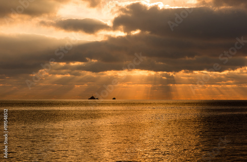 Fototapeta Naklejka Na Ścianę i Meble -  A golden sunrise in the sea of Ibiza