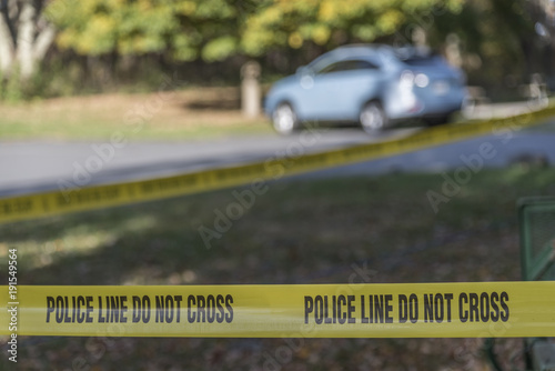 Crime scene blocked off with Police Do Not Cross Tape to restrict public access and maintain safety