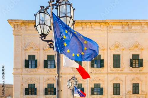 Malta Valletta - Auberge de castille (Government building) with EU Fags and Maltese Flags Flags of Europe, European Capital blue EU flag membership democracy Europäische Union kleinstes Land der EU photo