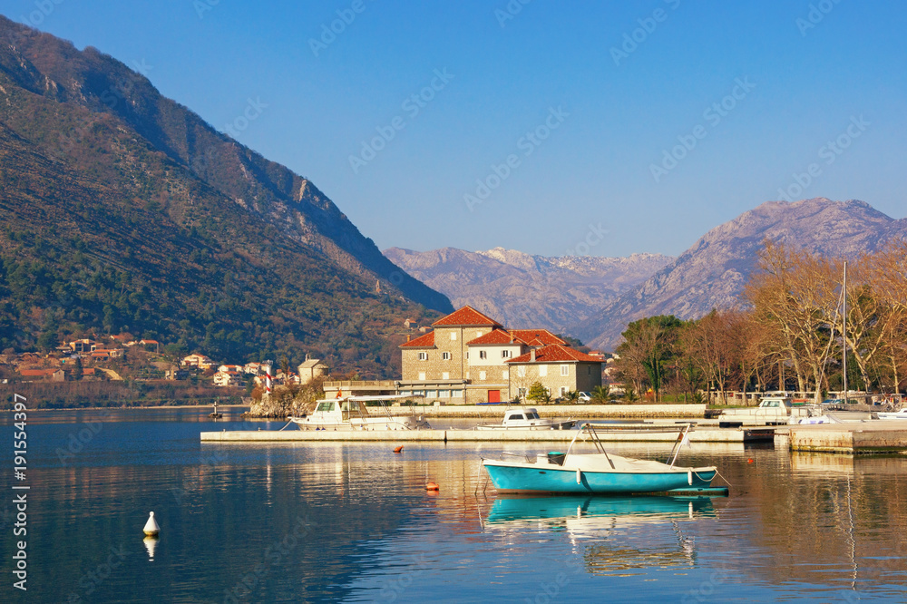 Sunny winter day in Montenegro. View of Bay of Kotor and building of the Institute of Marine Biology in Dobrota town