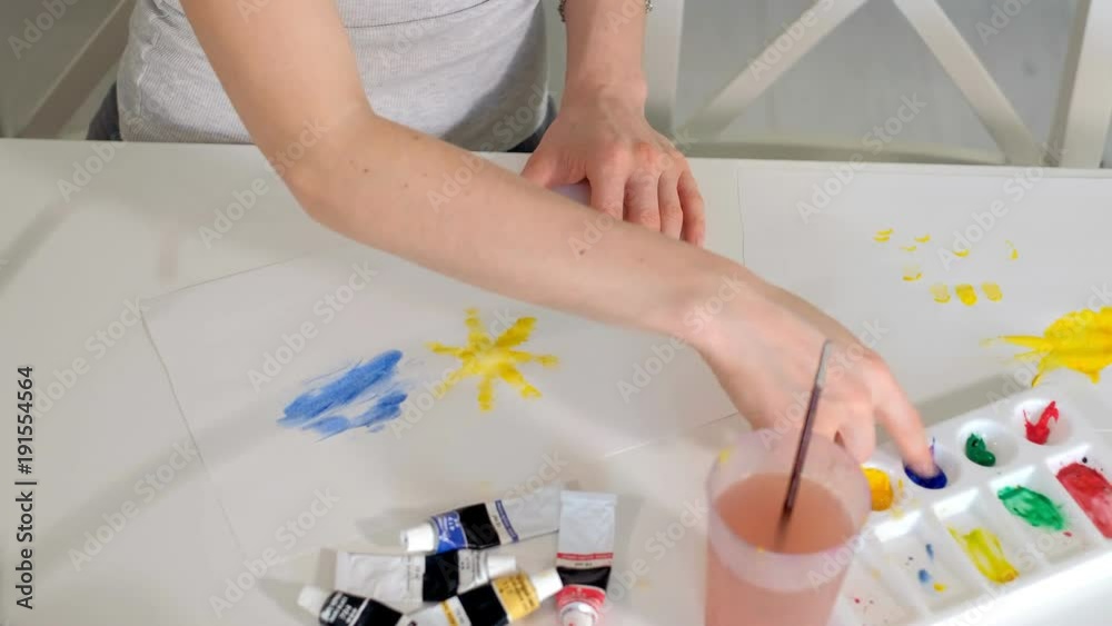 happy family mother and child girl paint paints at home happy family mother and child girl paint paints at home