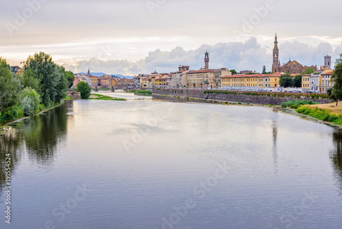 Daylight cloudy day view to Arno river with reflections