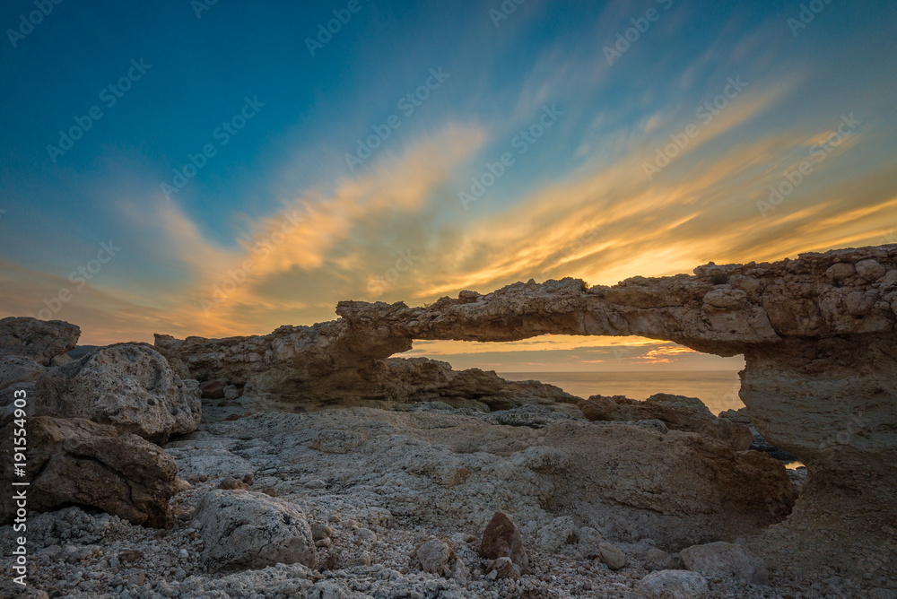 Natural arch of Portinatx at sunset, Ibiza, Spain
