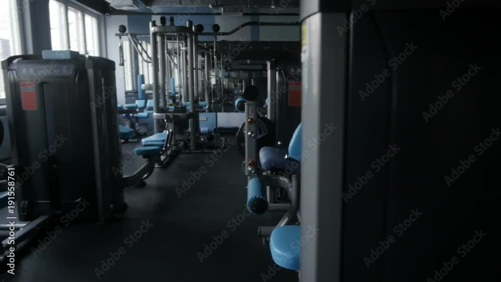 Bodybuilder is doing seated row Bodybuilder is doing seated row