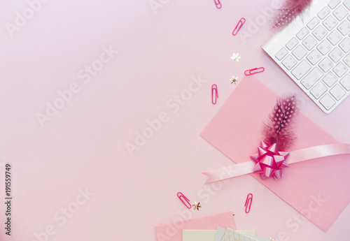 Flat lay, luxury feminine desk workspace on pink background with keyboard. Blogger concept © victoria