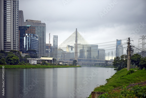 Buildings reflected in the waters of river