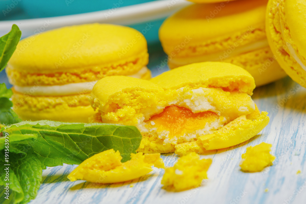Yellow macarons. French delicate dessert for Breakfast in the morning light Yellow macarons. French delicate dessert for Breakfast in the morning light