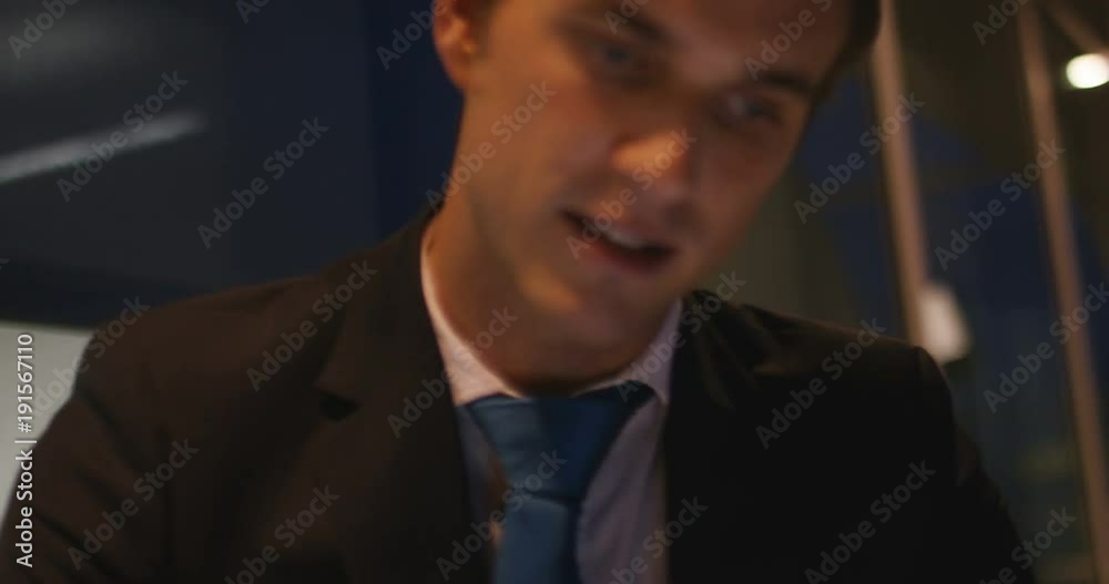 4K Close up businessman with colleague discussing sales graph on tablet computer 4K Close up businessman with colleague discussing sales graph on tablet computer