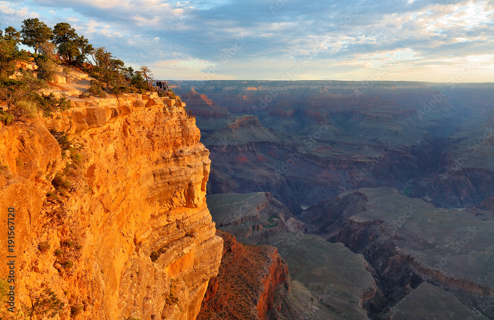 Sunrise at Mather Point, Grand Canyon National Park, Arizona. Photo Shows a Group of Tourists Watching Sunrise at Mather Point which is famous for Sunrise. Sunrise at Mather Point, Grand Canyon National Park, Arizona. Photo Shows a Group of Tourists Watching Sunrise at Mather Point which is famous for Sunrise.