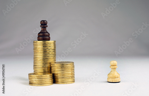 chess pieces piles of gold coins crisis intervention concept