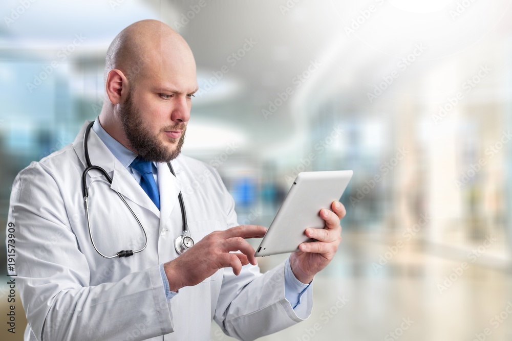 Doctor at hospital working with tablet Doctor at hospital working with tablet