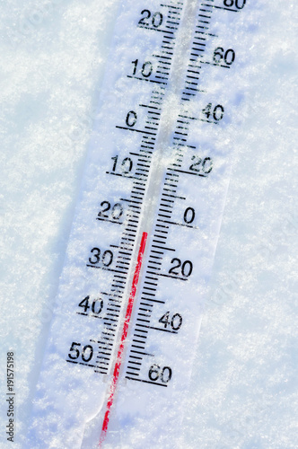 Thermometer in pure snow in frosty weather