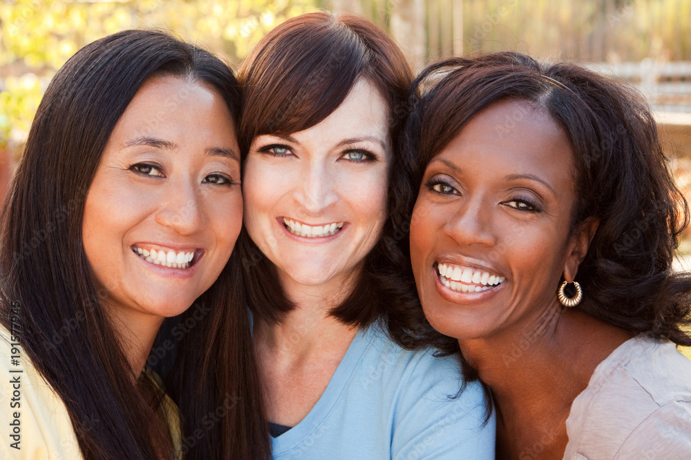 Diverse group of women talking and laughing.