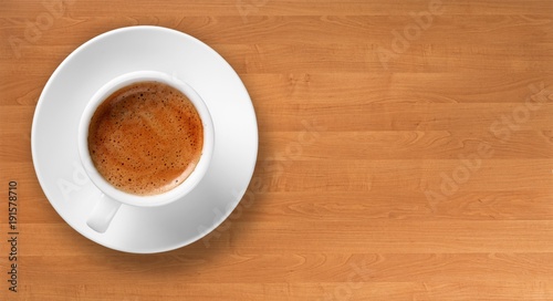 Coffee cup on wooden desk
