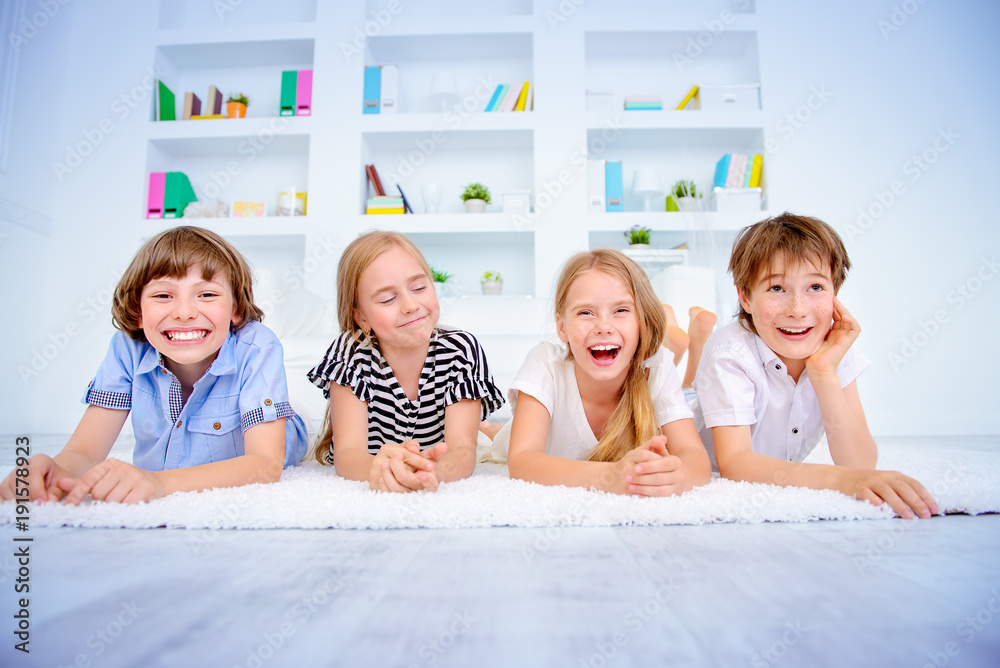 children lie on floor children lie on floor