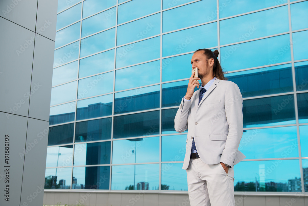 a businessman in a suit around the office a businessman in a suit around the office