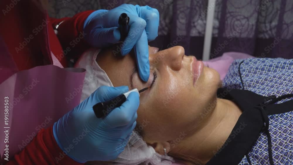 procedure in the beauty salon lamination of eyelashes. Saturation of