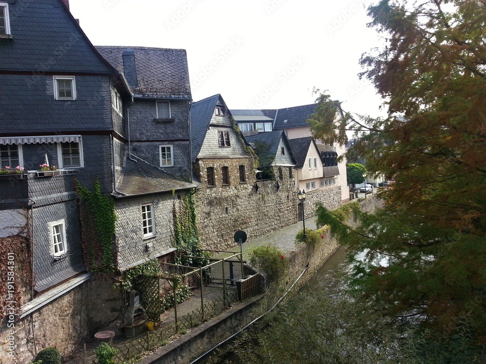 Tranquil view over river and old houses in Wetzlar