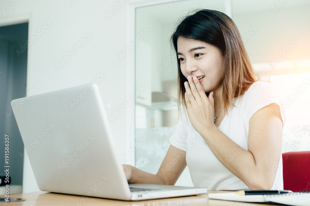 Young asian girl is freelancer with her private business at home office, working with laptop, coffee, online marketing, Customer order and packaging or packing. Young asian girl is freelancer with her private business at home office, working with laptop, coffee, online marketing, Customer order and packaging or packing.