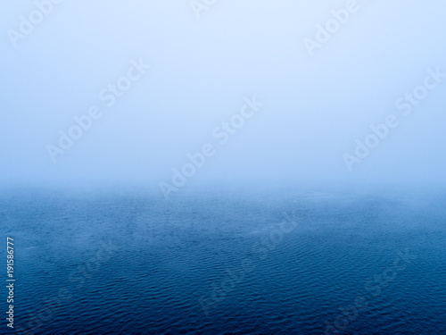 Simplistic aerial view of foggy sea